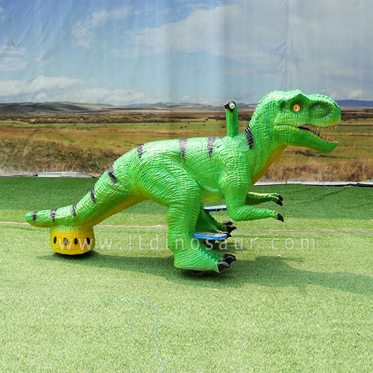 Triciclo con forma de dinosaurio verde 